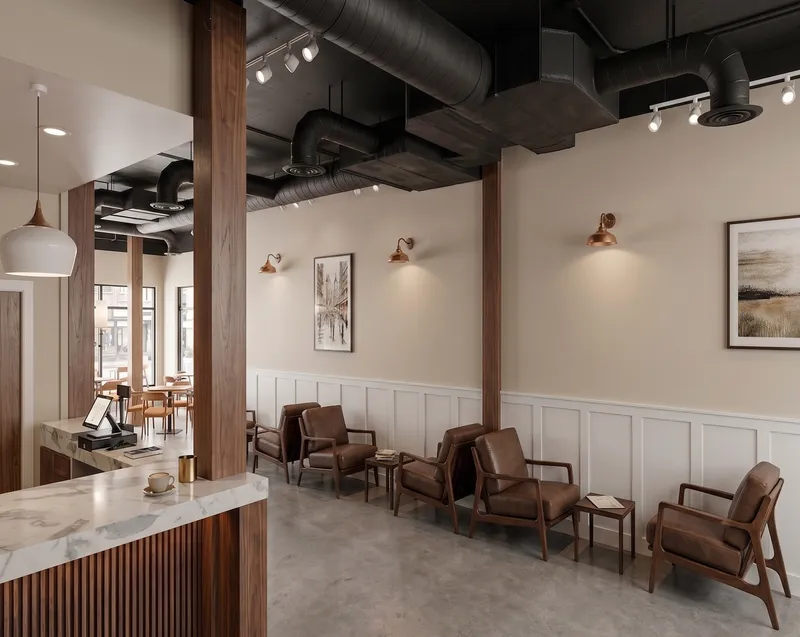 The Bayit Brew lounge — leather armchairs along a wainscoted wall under copper sconces, with the service bar in the foreground.